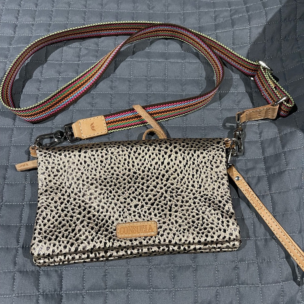 Consuela crossbody.  Gold with black spots and silver hardware.  Very neutral